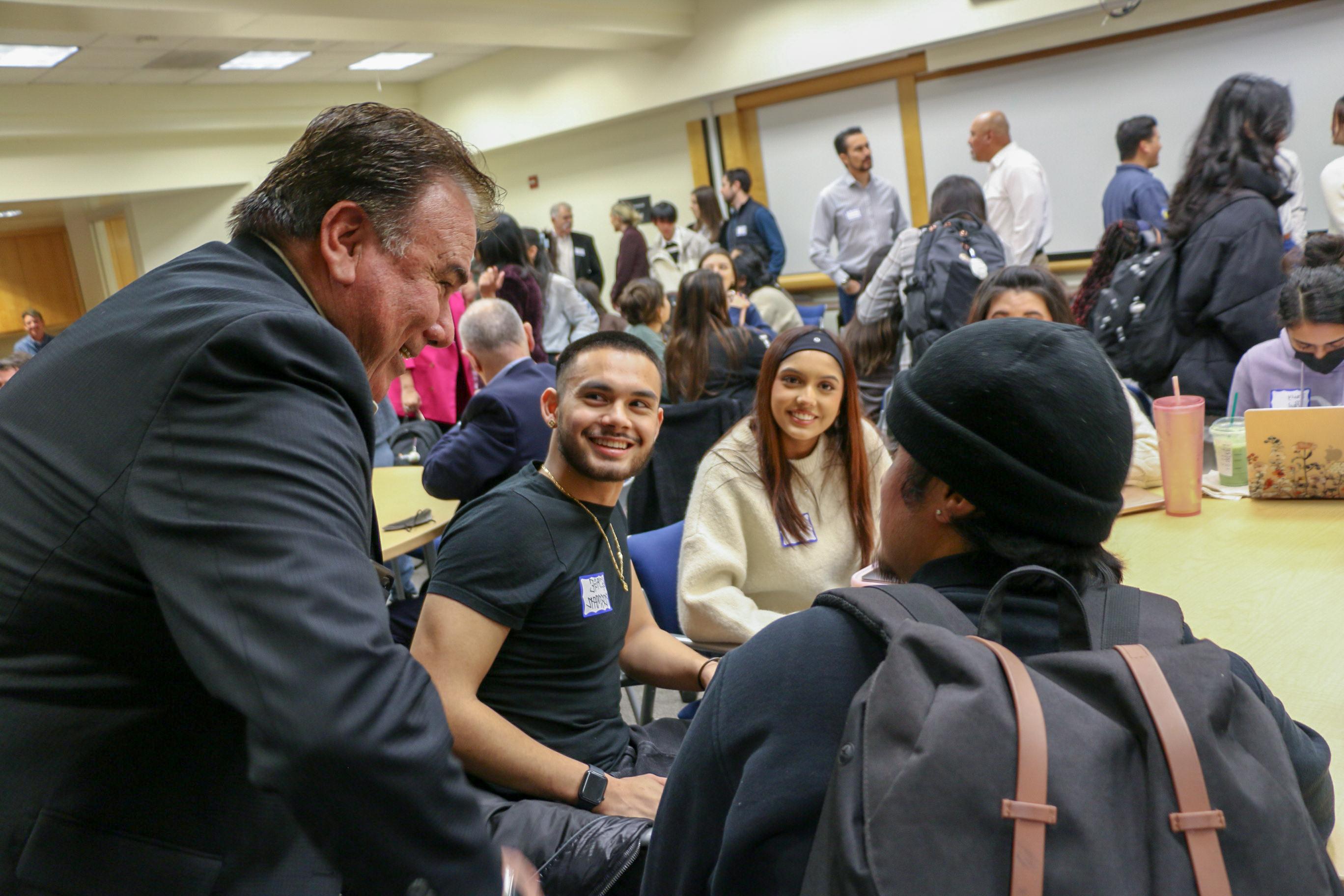 Students and professionals network at a CLI session